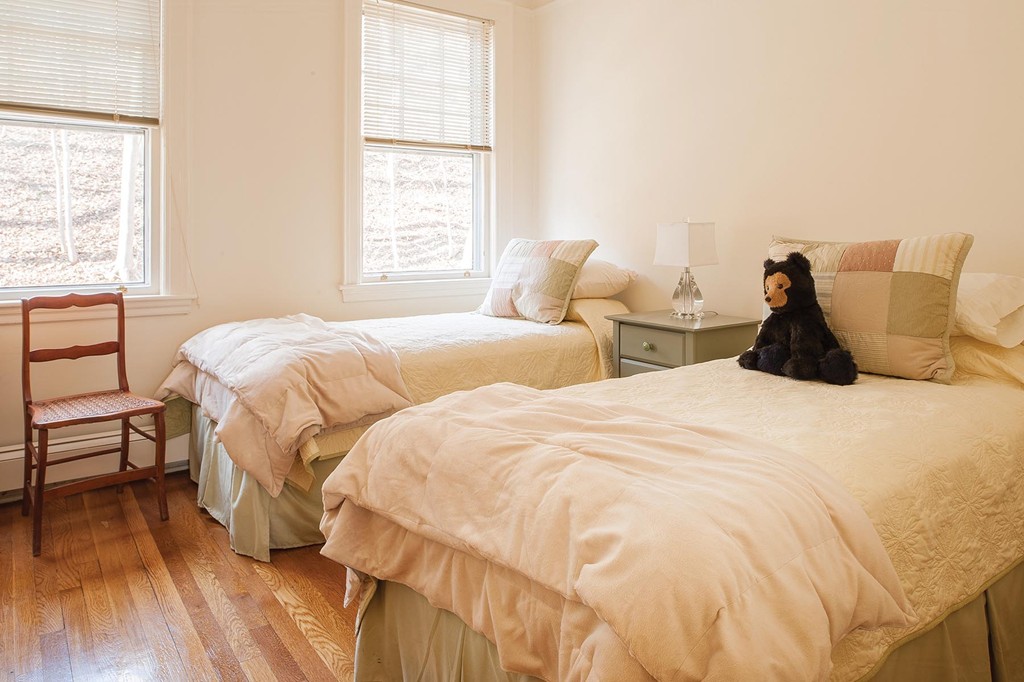 82 Atherton Road, Unit 2 Brookline, MA 02446 - Photo 9 of 9 a bedroom with two beds and a chair