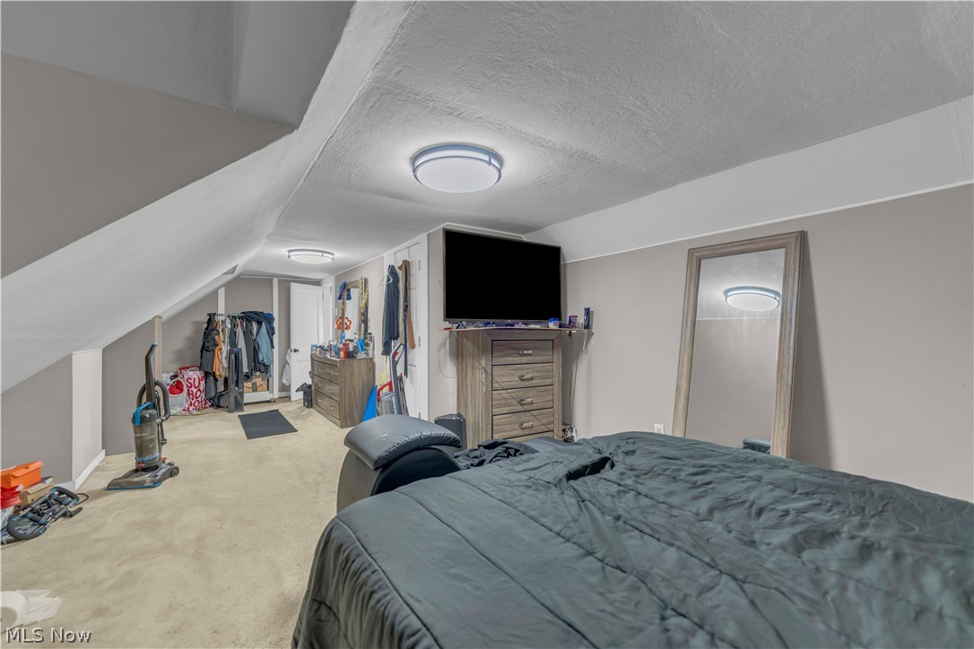 3731 Lowell Road Cleveland Heights, OH 44121 - Photo 20 of 29 Spacious attic bedroom with sloped ceilings and abundant natural light from recessed ceiling fixture