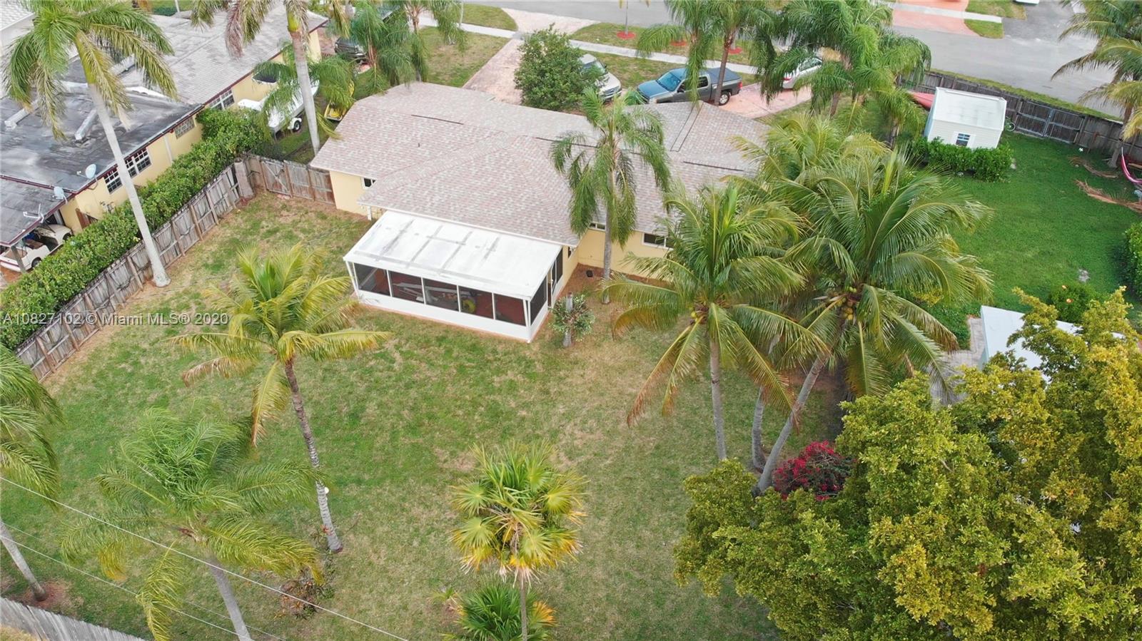 3198 Arthur Terrace Hollywood, FL 33021 - Photo 13 of 18 an aerial view of a house with a yard and garden
