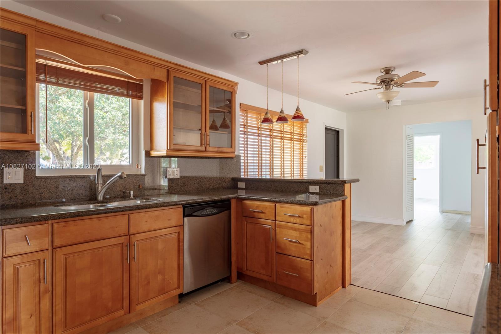 3198 Arthur Terrace Hollywood, FL 33021 - Photo 2 of 18 a kitchen with stainless steel appliances granite countertop a sink stove and cabinets