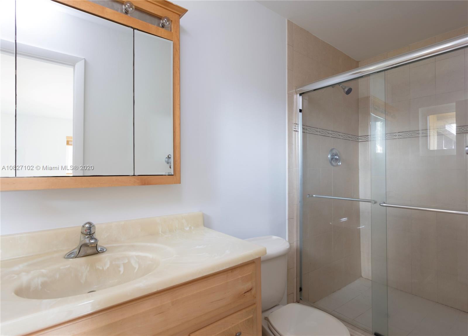 3198 Arthur Terrace Hollywood, FL 33021 - Photo 5 of 18 a bathroom with a sink toilet vanity and shower