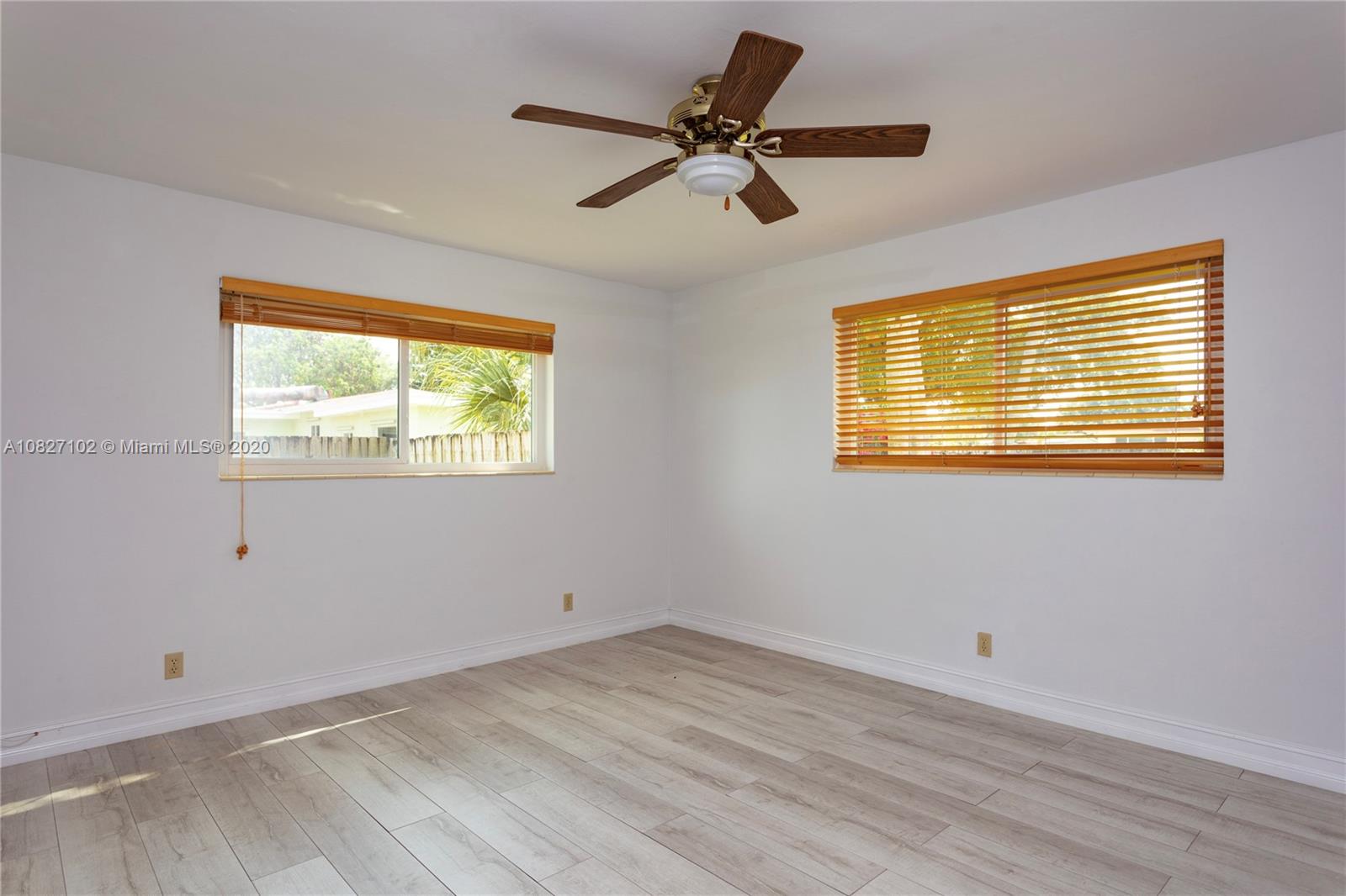 3198 Arthur Terrace Hollywood, FL 33021 - Photo 7 of 18 a view of empty room with wooden floor and fan