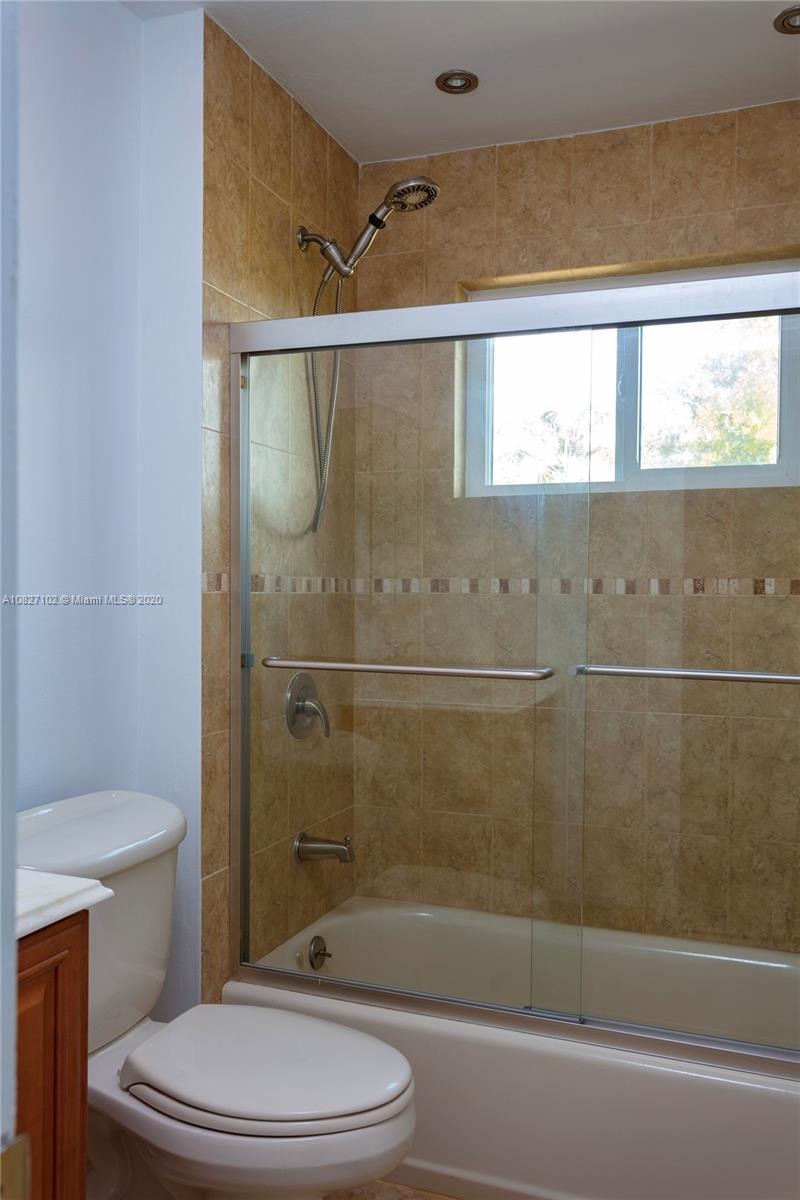 3198 Arthur Terrace Hollywood, FL 33021 - Photo 8 of 18 a bathroom with a toilet and a shower
