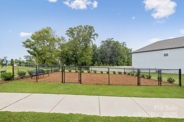 a view of a patio with table and chairs