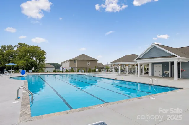 a view of house with yard and entertaining space