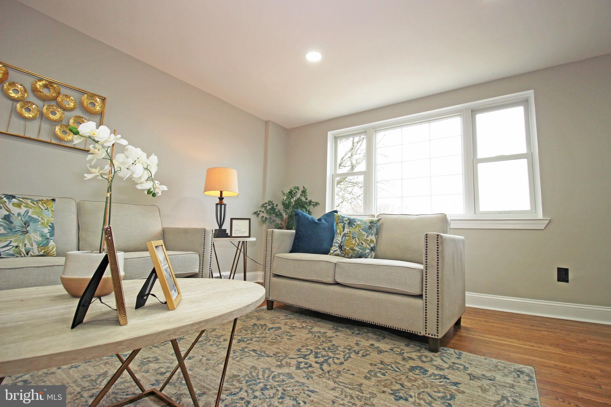 4017 Gideon Road Brookhaven, PA 19015 - Photo 12 of 54 a living room with furniture a table and wooden floor
