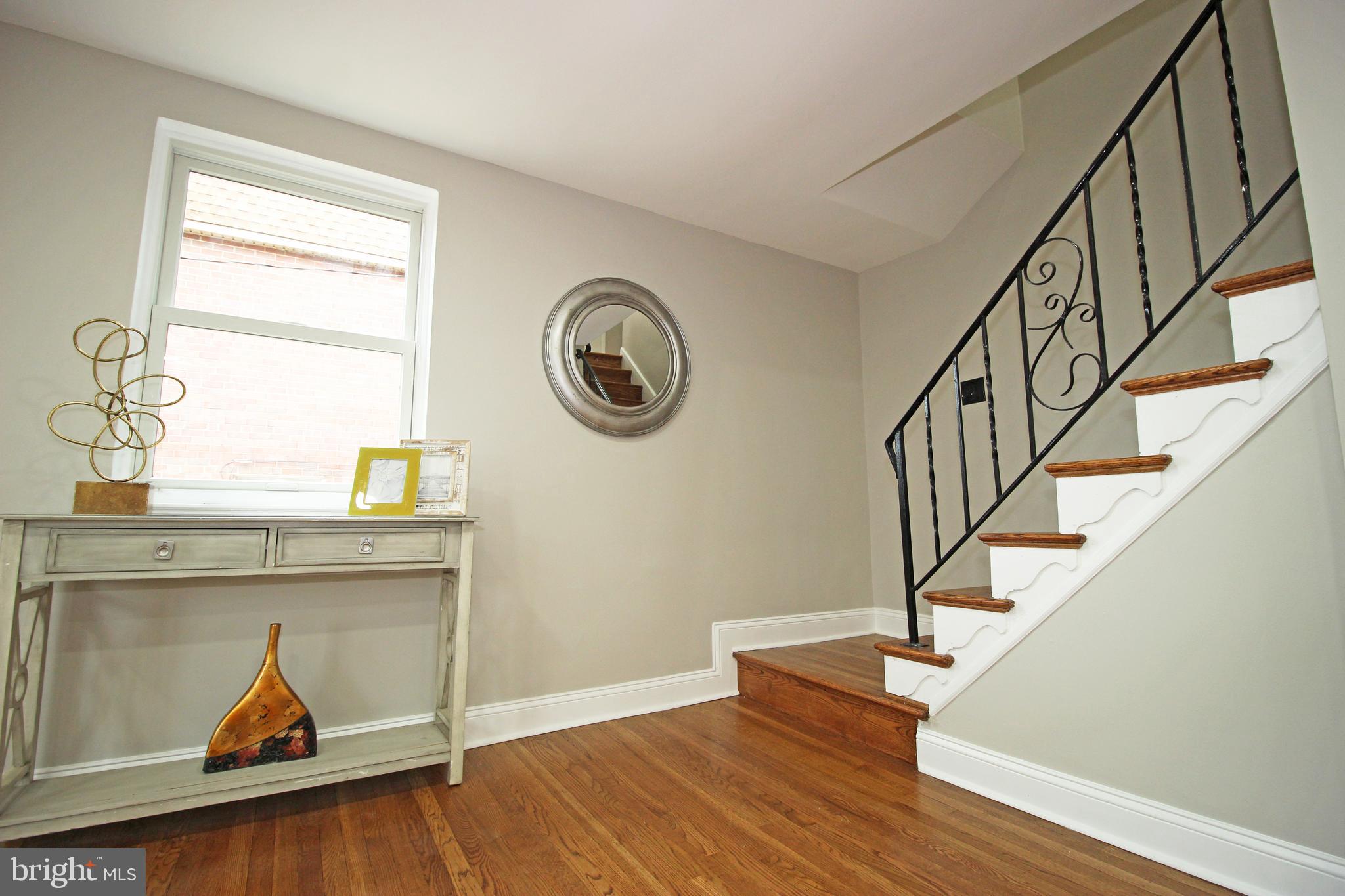 4017 Gideon Road Brookhaven, PA 19015 - Photo 28 of 54 a view of a hallway with wooden floor and staircase
