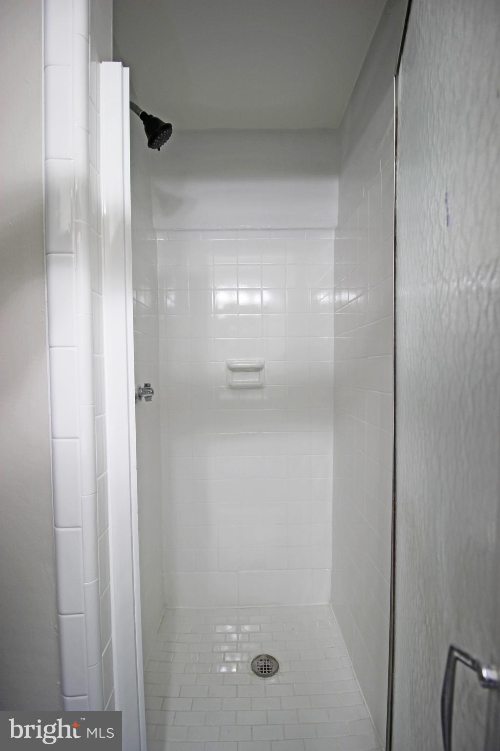 4017 Gideon Road Brookhaven, PA 19015 - Photo 33 of 54 a bathroom with a glass shower door