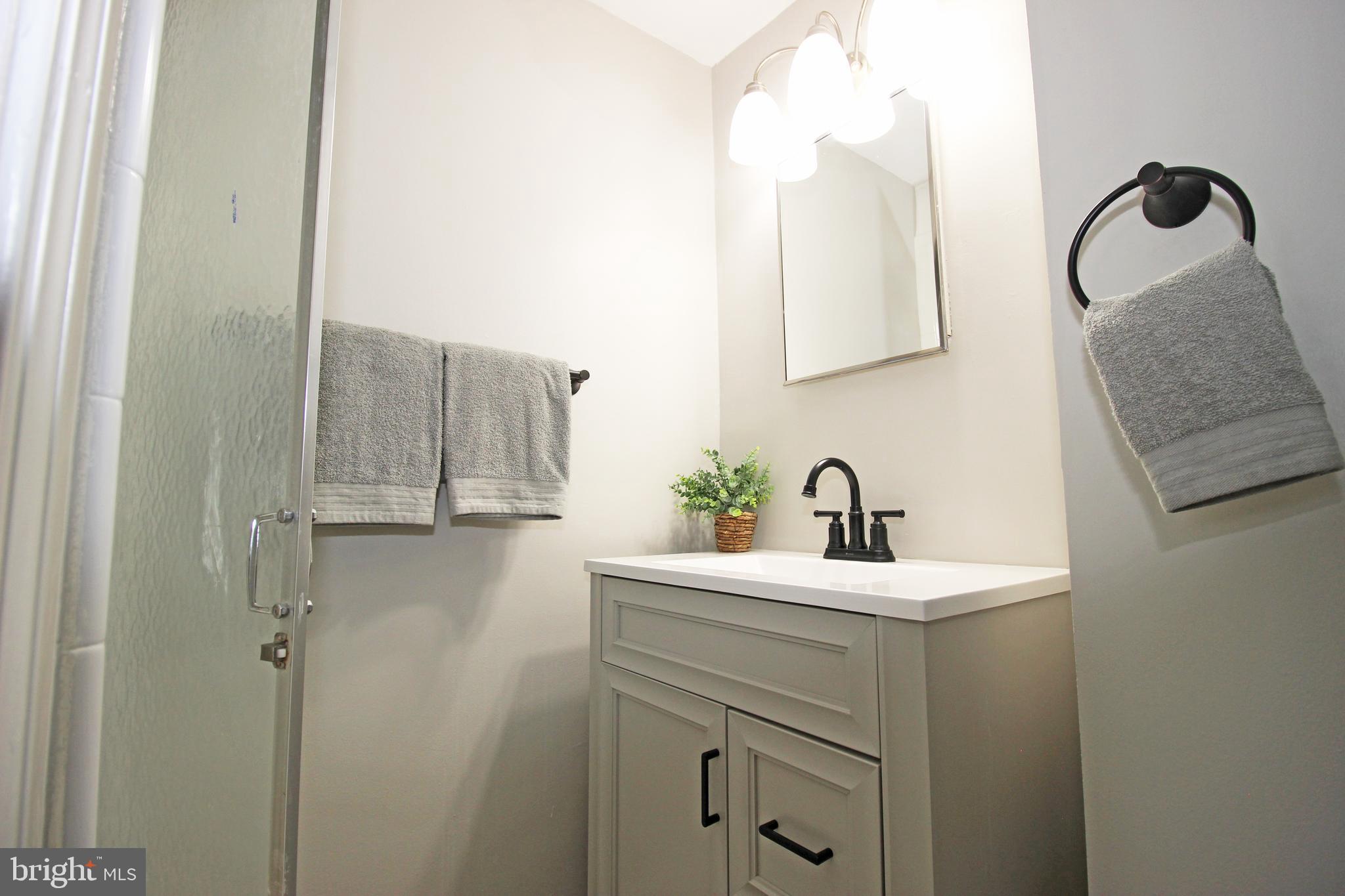 4017 Gideon Road Brookhaven, PA 19015 - Photo 35 of 54 a bathroom with a sink a toilet and mirror