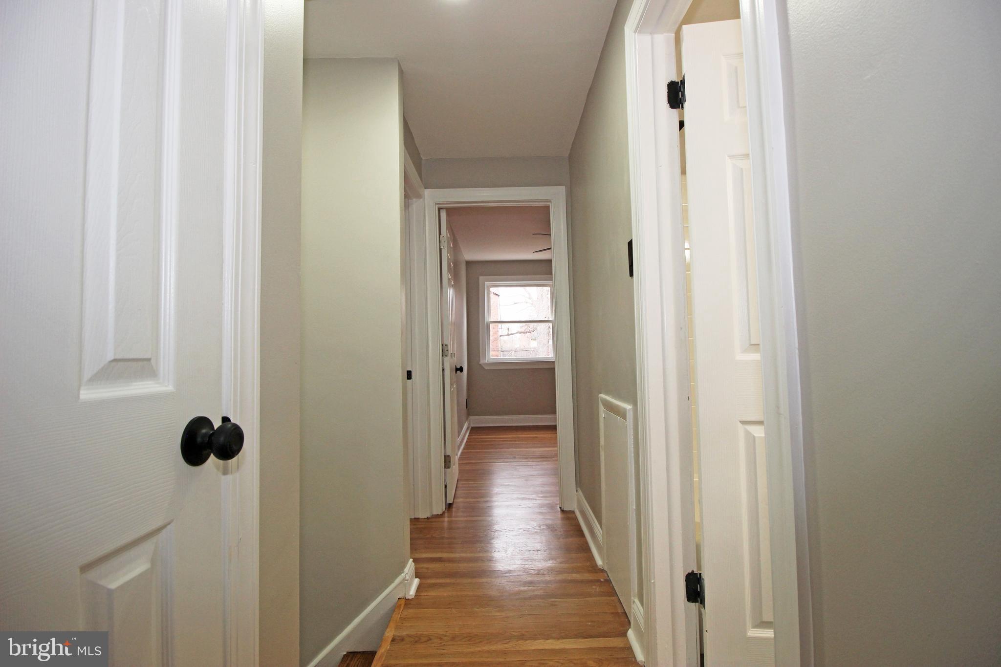 4017 Gideon Road Brookhaven, PA 19015 - Photo 36 of 54 a view of a hallway with wooden floor and closet