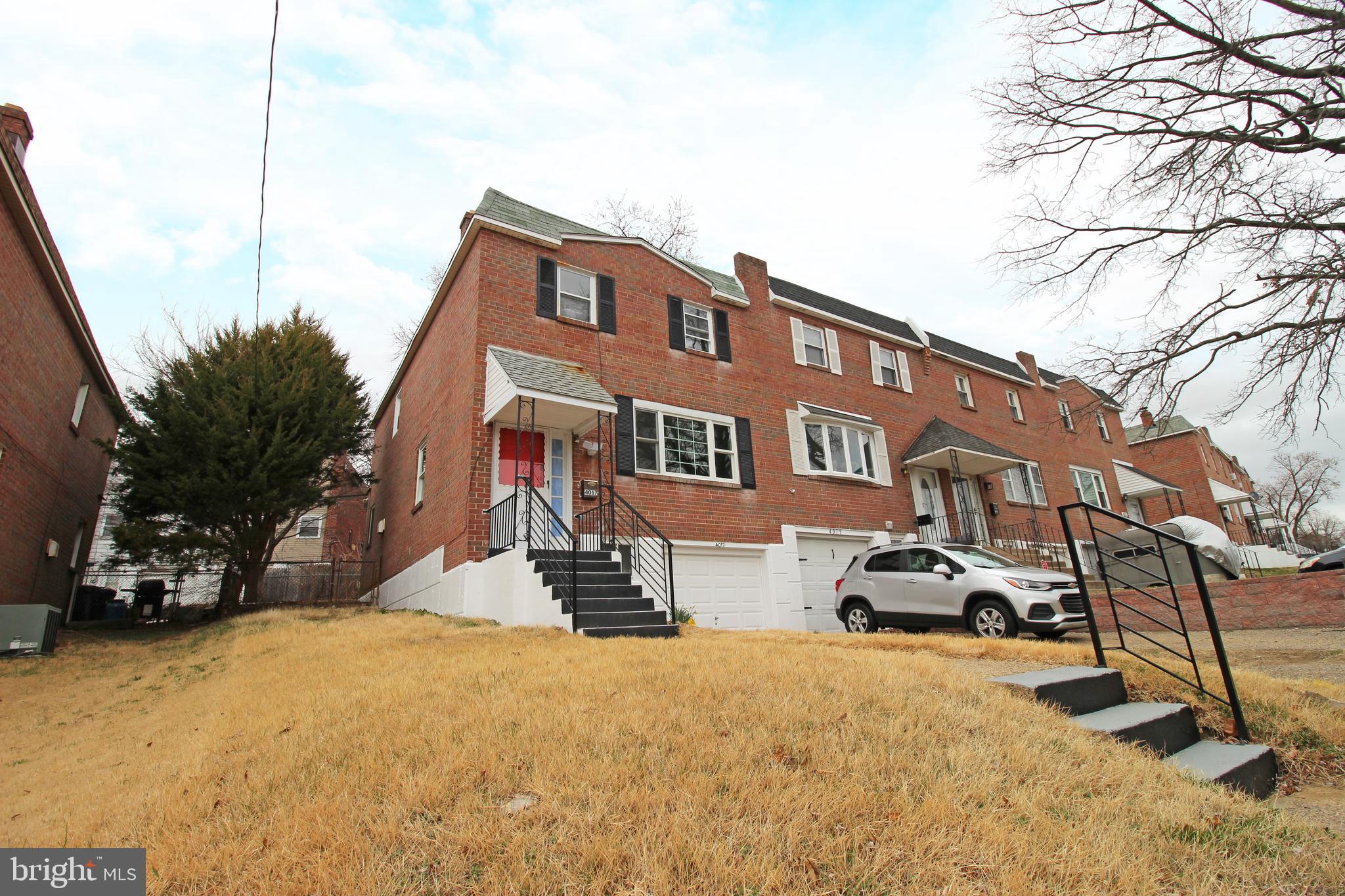 4017 Gideon Road Brookhaven, PA 19015 - Photo 4 of 54 a front view of a house with cars parked