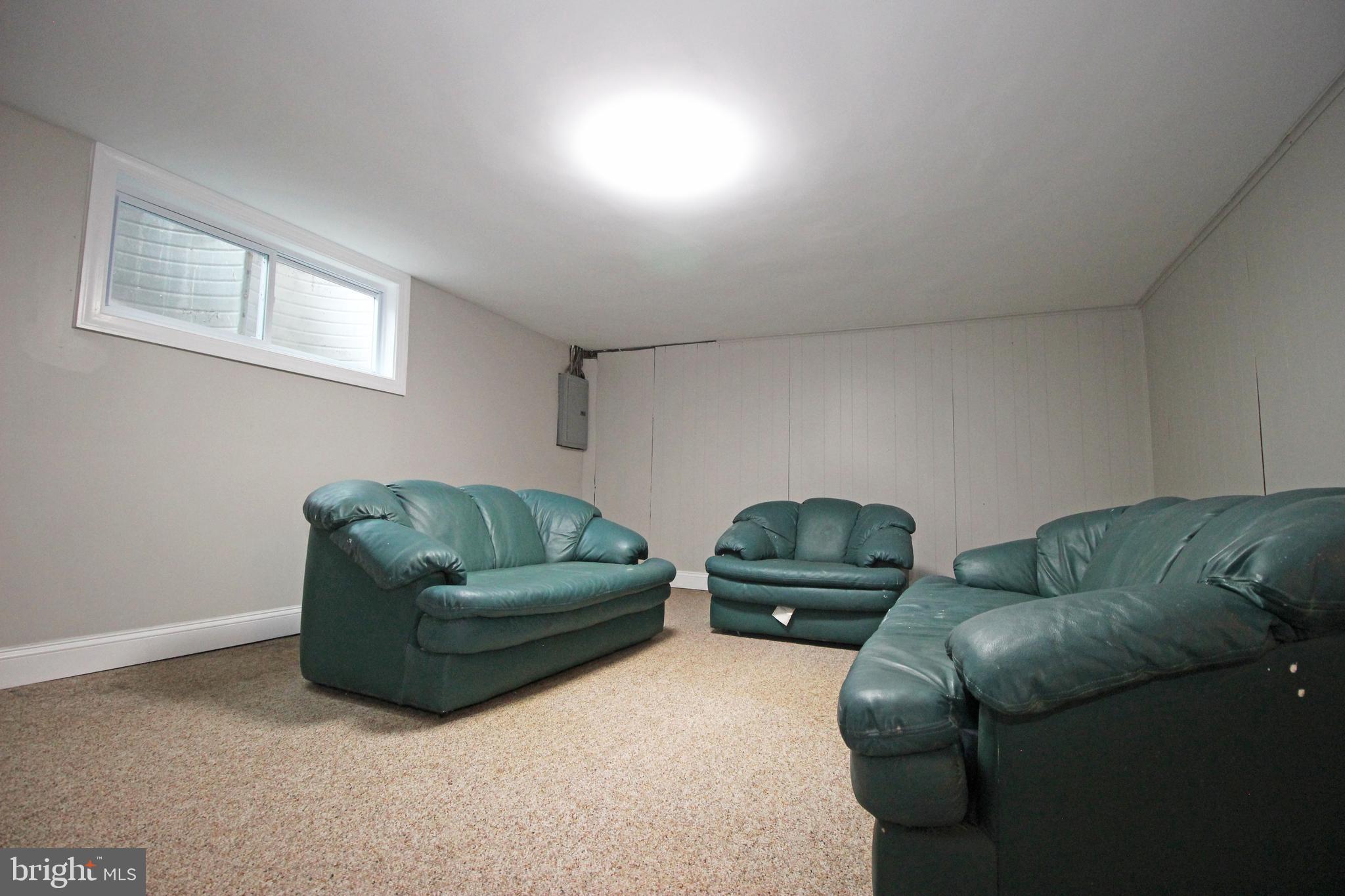 4017 Gideon Road Brookhaven, PA 19015 - Photo 48 of 54 a living room with furniture and a window