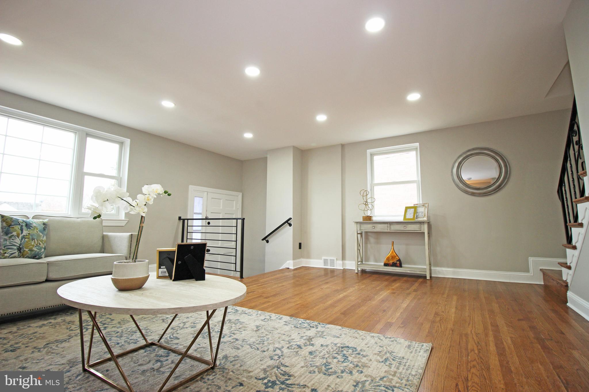 4017 Gideon Road Brookhaven, PA 19015 - Photo 9 of 54 a living room with furniture a dining table and a large window