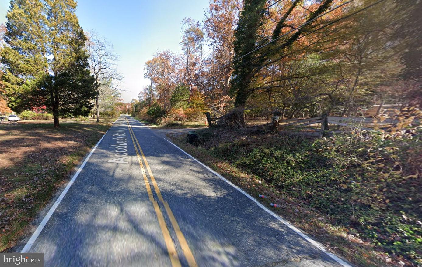 a view of backyard with green space
