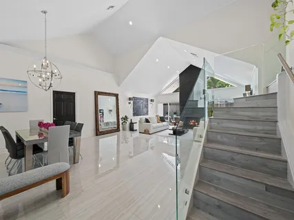 a view of a living room and dining room