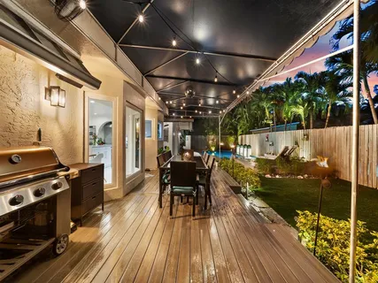 a view of a chairs and table in a patio