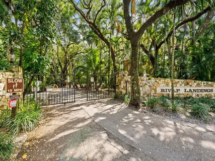 a view of outdoor space with deck and trees