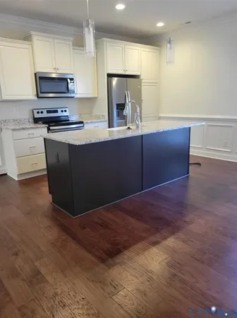 a view of a room with wooden floor and window