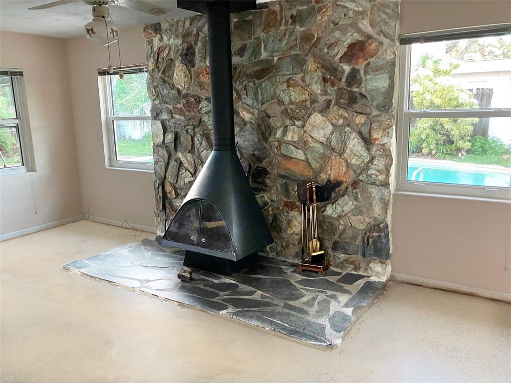 1221 12th Court Southwest Largo, FL 33770 - Photo 8 of 13 a living room with a fireplace