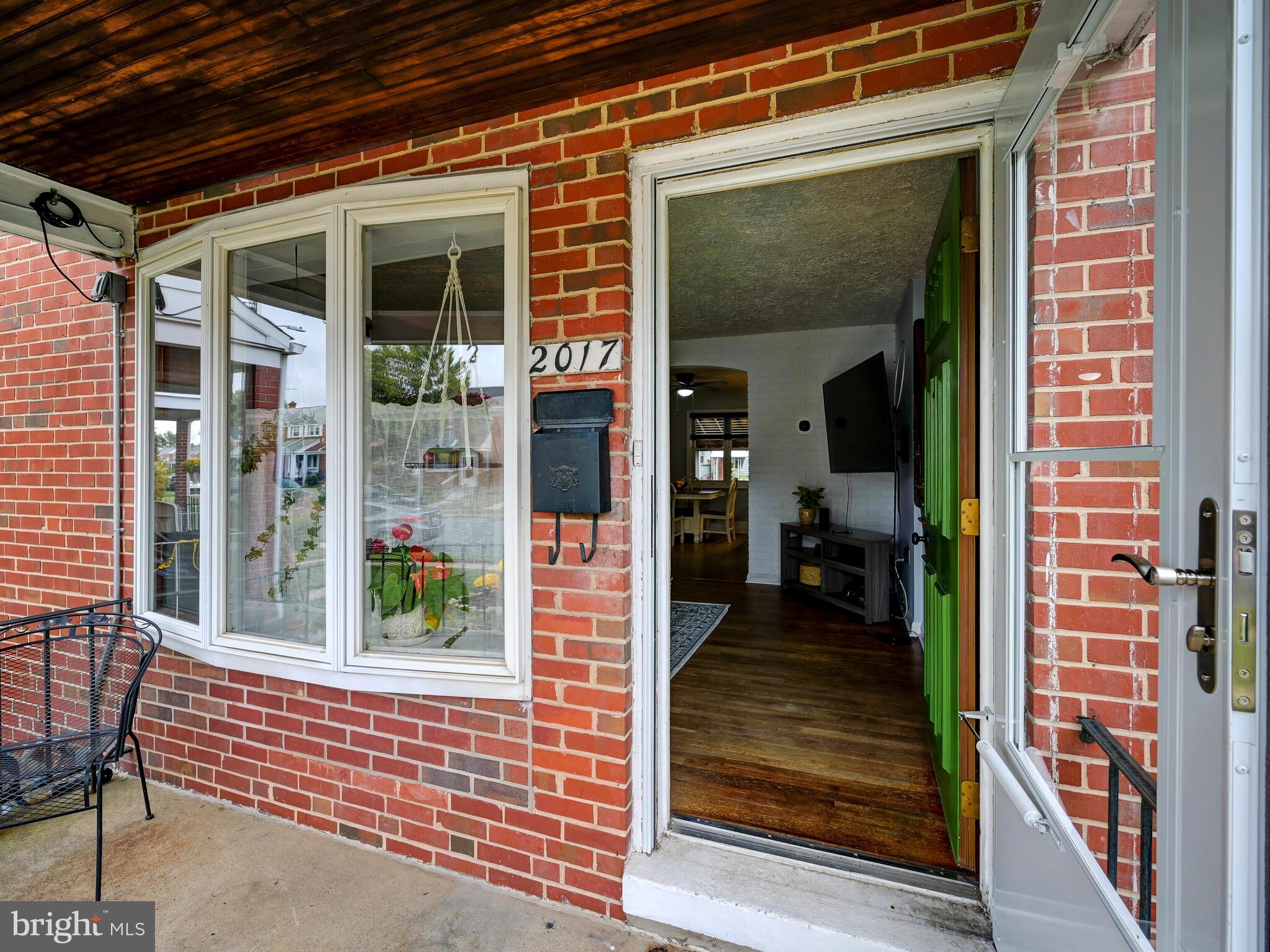 2017 Wareham Road Baltimore, MD 21222 - Photo 6 of 36 Bow window and insulated storm door