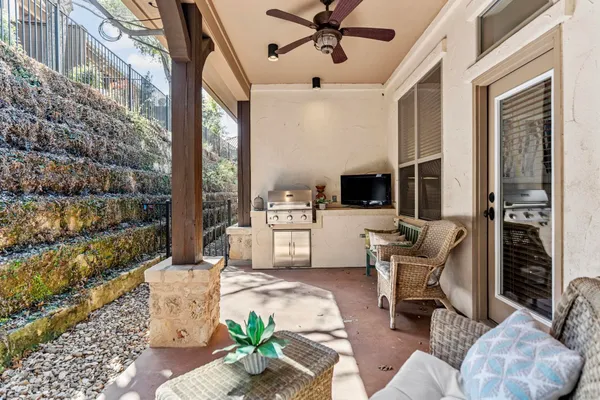 a living room with furniture a flat screen tv and a wall