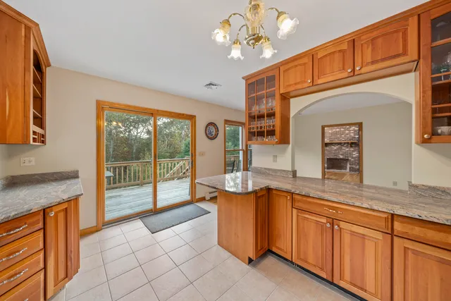 a kitchen with stainless steel appliances granite countertop a sink and cabinets