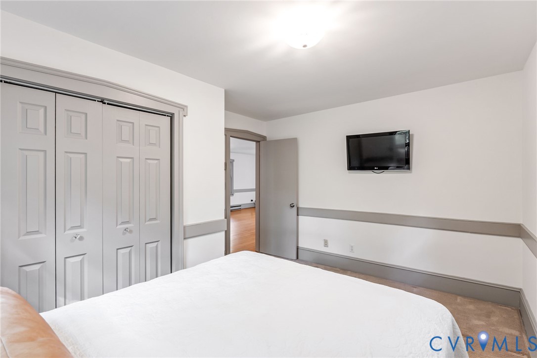 71 Old Mill Road Dillwyn, VA 23936 - Photo 16 of 31 First-floor primary with carpet and a spacious clo