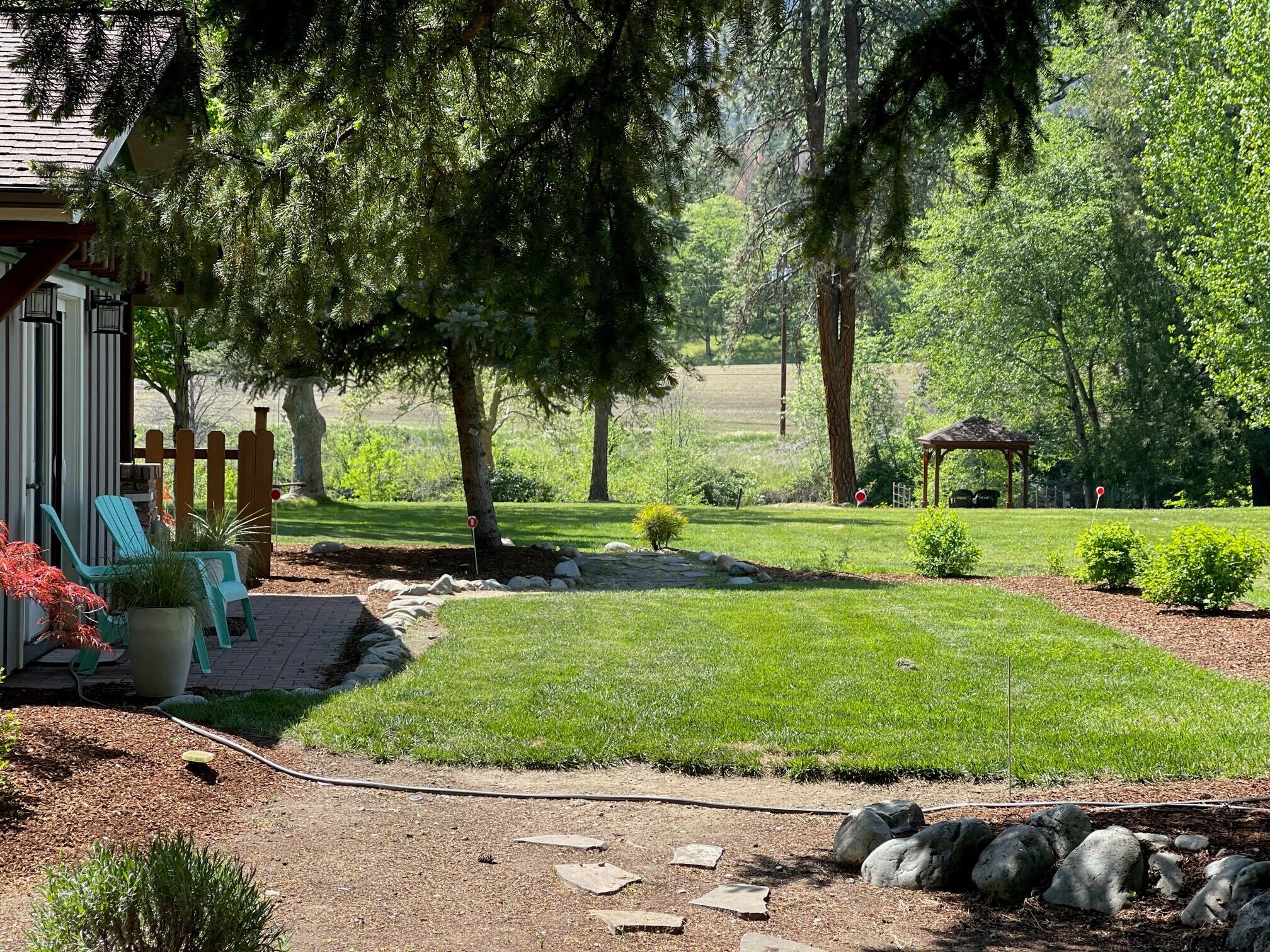 3828 Upper Applegate Road Jacksonville, OR 97530 - Photo 8 of 69 a view of a backyard with large trees