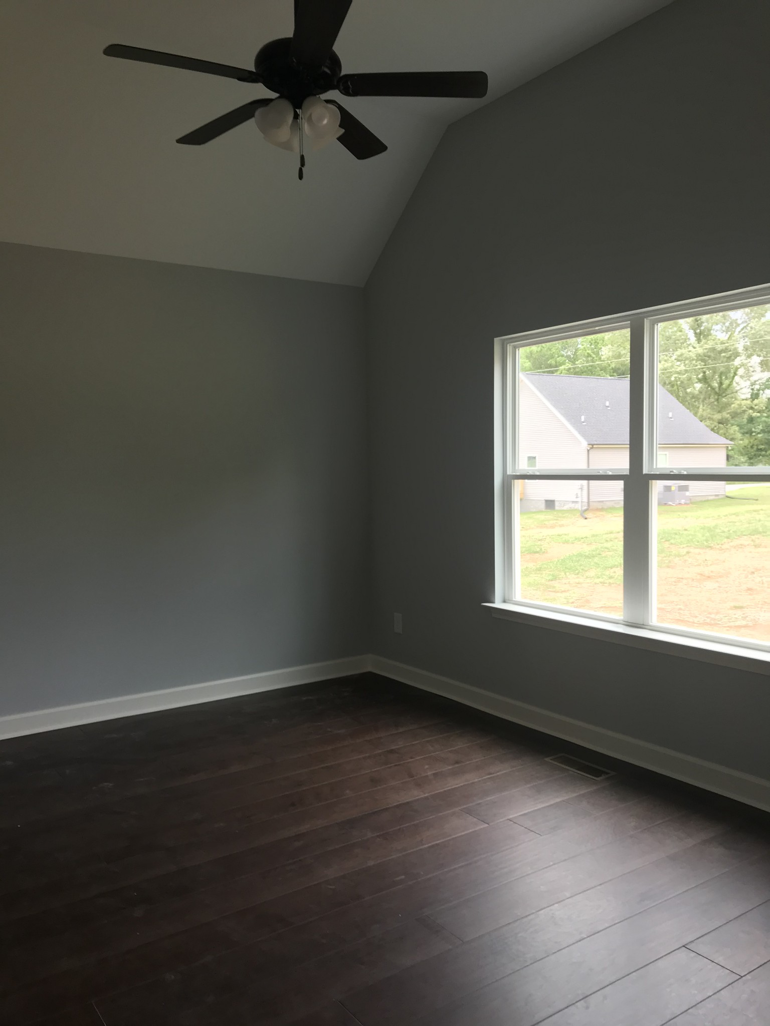 461 Pruett Road Dickson, TN 37055 - Photo 12 of 20 an empty room with wooden floor and windows