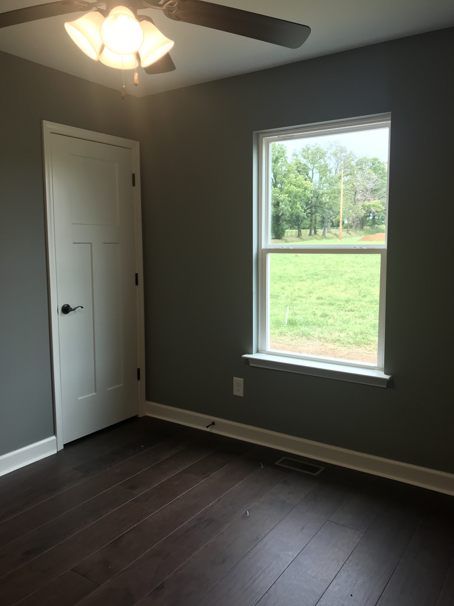 461 Pruett Road Dickson, TN 37055 - Photo 17 of 20 a view of an empty room with wooden floor and a window