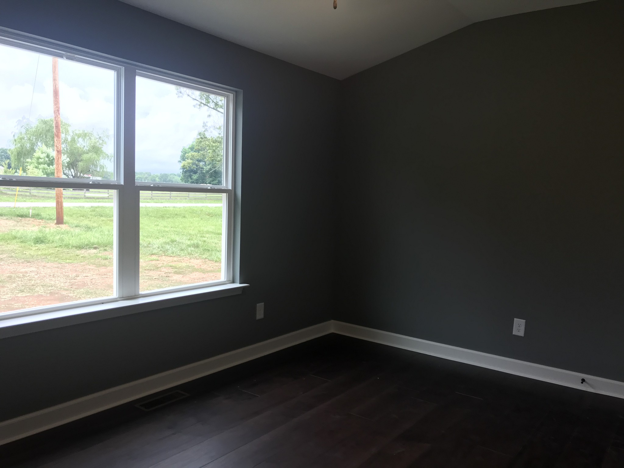 461 Pruett Road Dickson, TN 37055 - Photo 18 of 20 a view of an empty room with wooden floor and a window