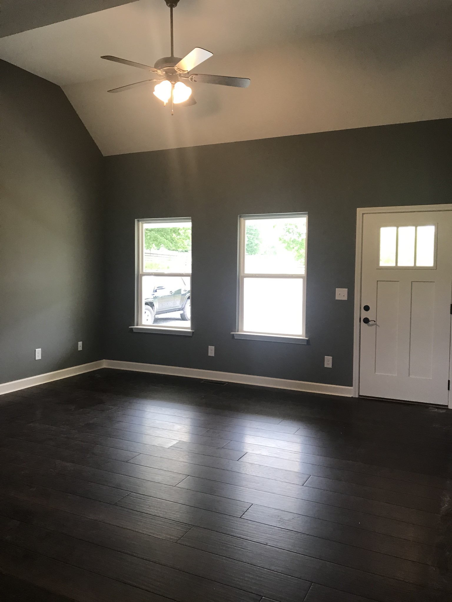 461 Pruett Road Dickson, TN 37055 - Photo 4 of 20 a view of an empty room with wooden floor and a window