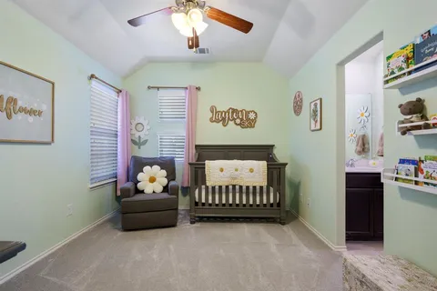 a bedroom with furniture and a window