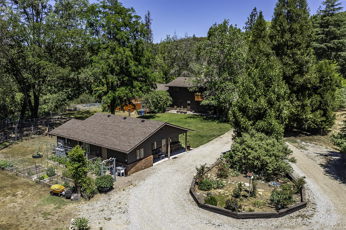 7785 Old Stage Road Central Point, OR 97502 - Photo 3 of 47 a view of a house with a porch patio and furniture