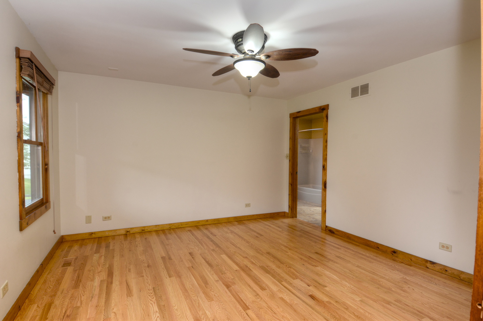 44W290 Plank Road Hampshire, IL 60140 - Photo 13 of 31 a view of an empty room with wooden floor and a window