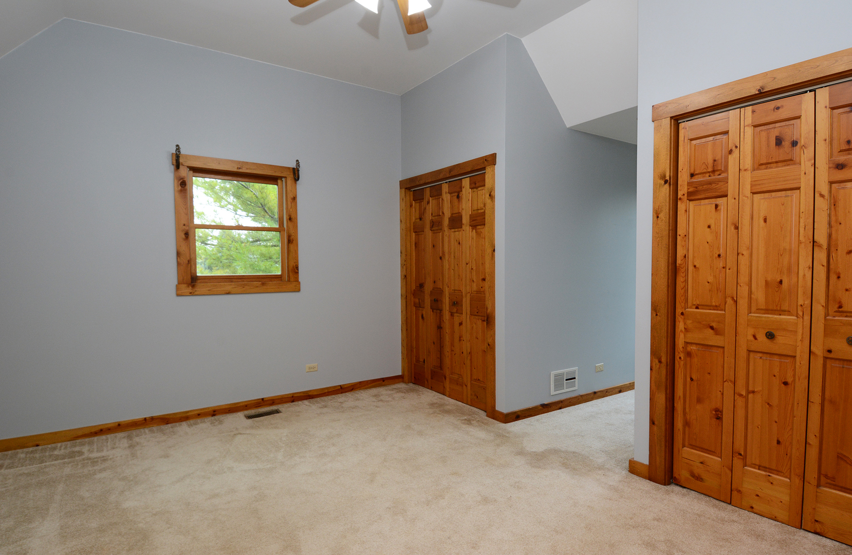 44W290 Plank Road Hampshire, IL 60140 - Photo 18 of 31 an empty room with windows closet and chandelier fan