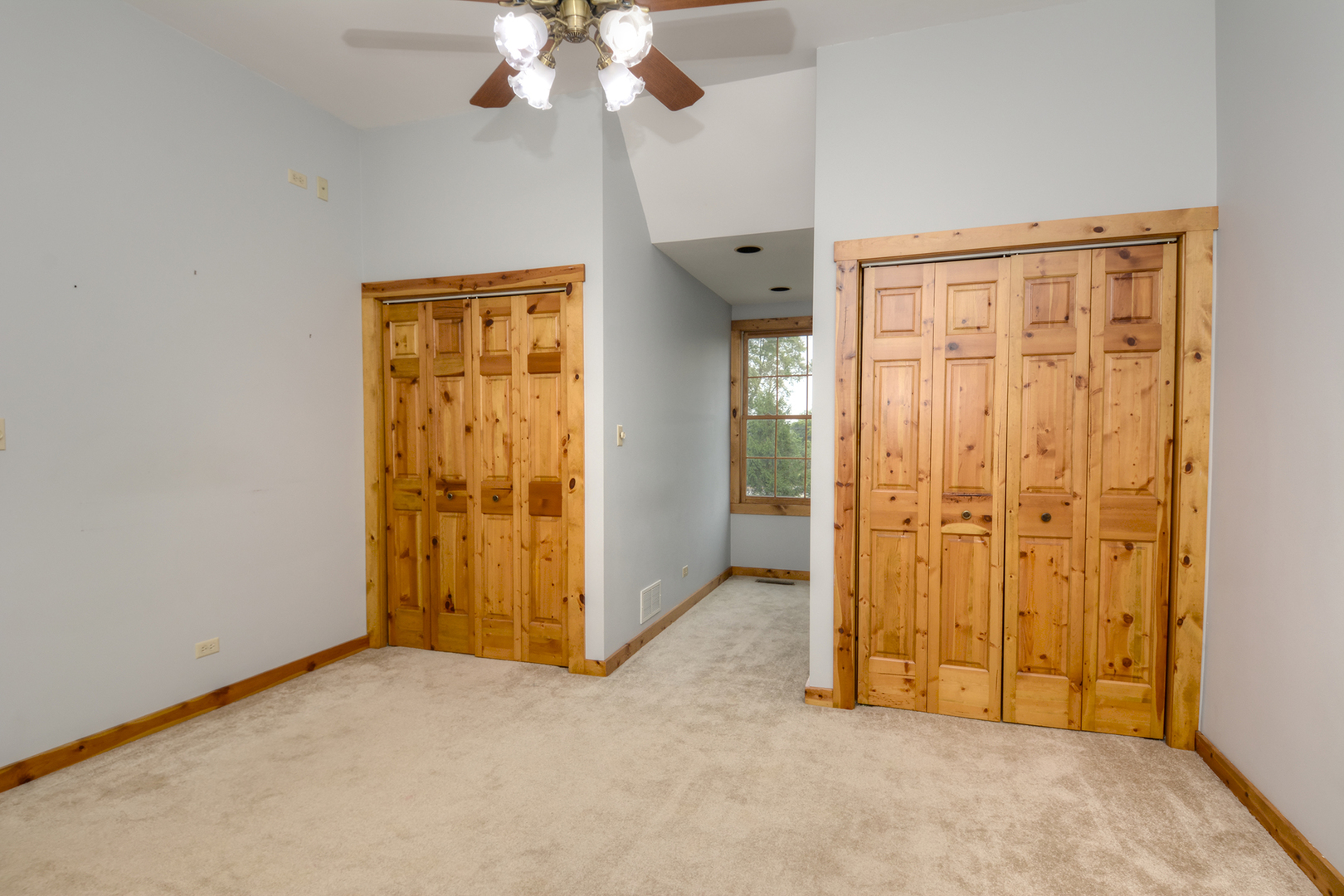 44W290 Plank Road Hampshire, IL 60140 - Photo 19 of 31 an empty room with closet and a chandelier fan