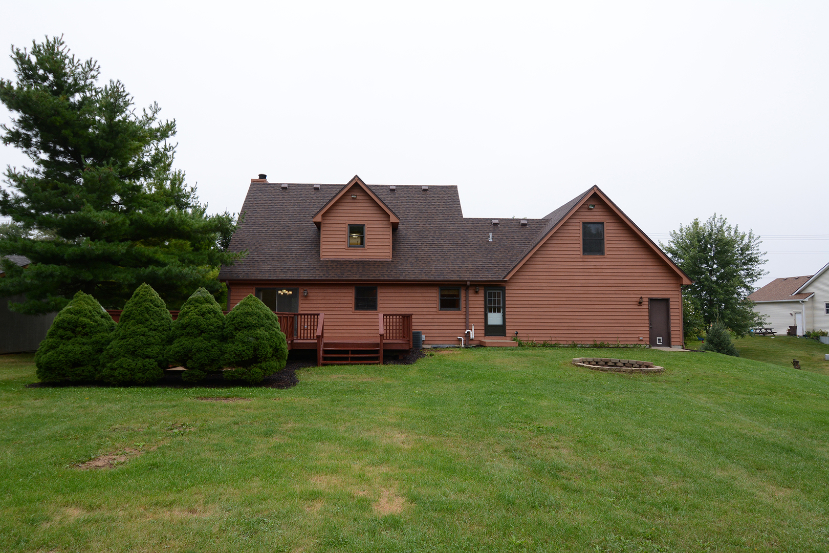 44W290 Plank Road Hampshire, IL 60140 - Photo 29 of 31 a house that is sitting in the grass with large trees