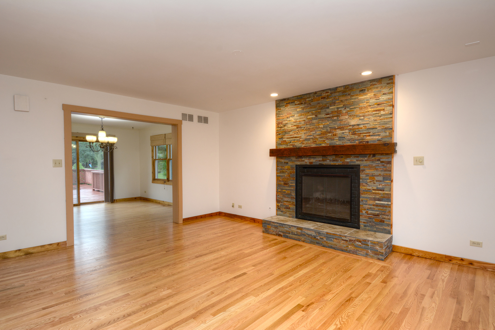 44W290 Plank Road Hampshire, IL 60140 - Photo 4 of 31 wooden floor fireplace and natural light in room