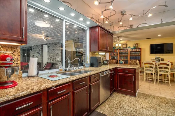 a kitchen with lots of counter top space and appliances