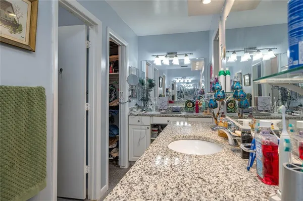 a bedroom with furniture and a window