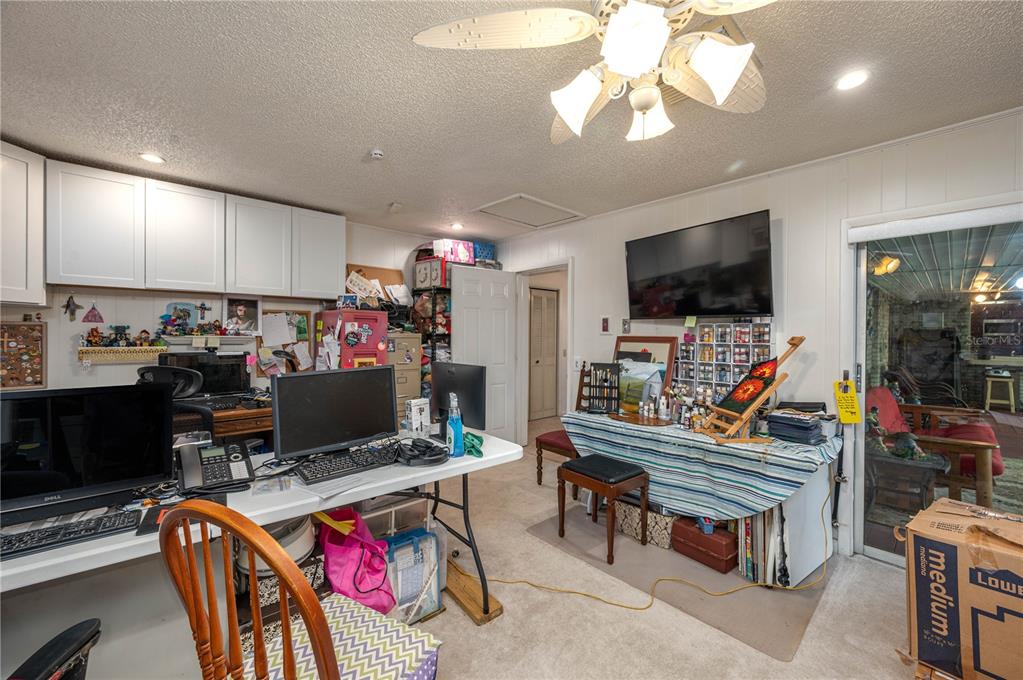 305 Hernando Road Winter Haven, FL 33884 - Photo 28 of 32 a living room with furniture a flat screen tv and a window