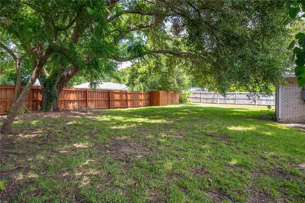 a backyard of a house with lots of green space