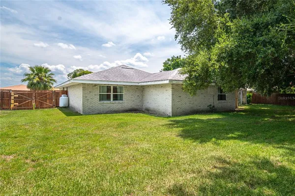 a backyard of a house with lots of green space