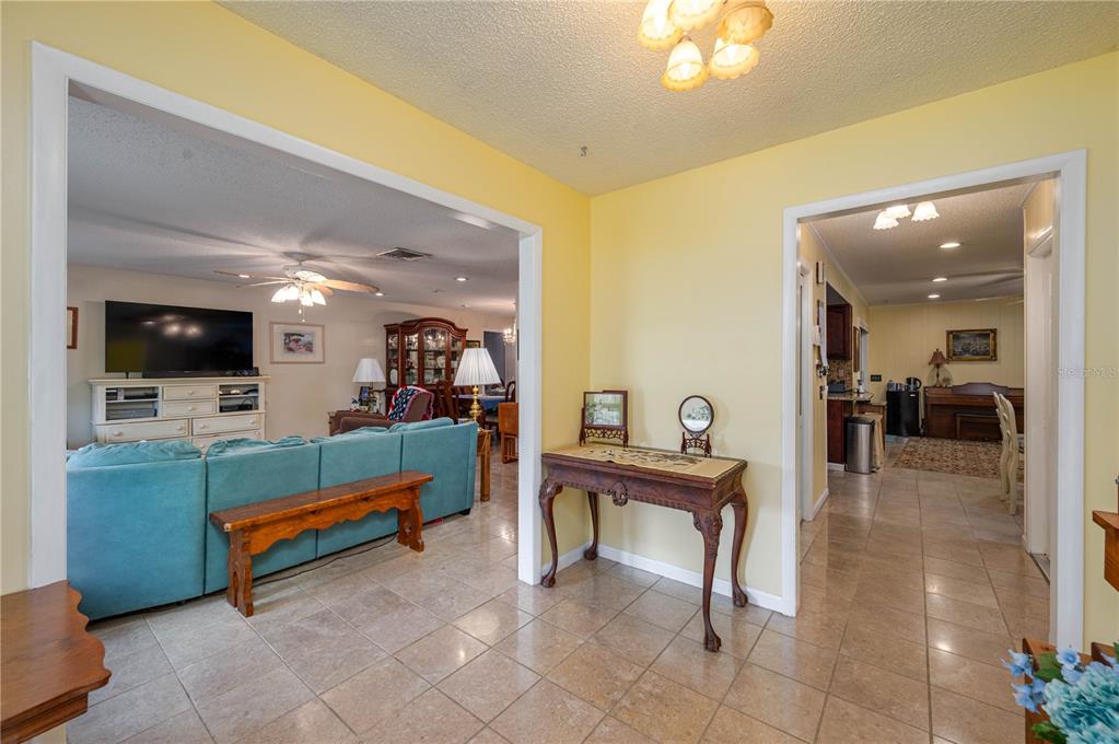305 Hernando Road Winter Haven, FL 33884 - Photo 4 of 32 a living room with furniture and a flat screen tv