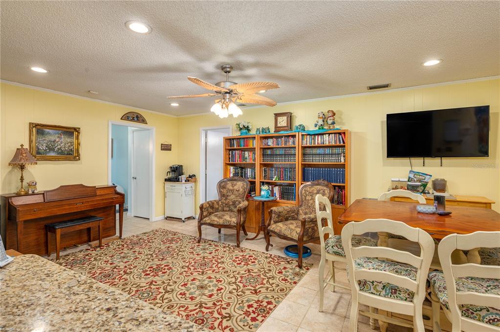 305 Hernando Road Winter Haven, FL 33884 - Photo 8 of 32 a living room with furniture and a flat screen tv