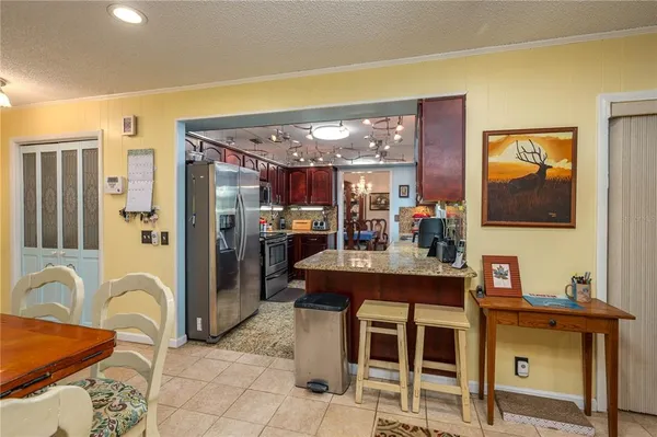 a view of a kitchen area with furniture and chandelier