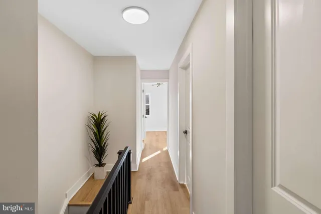 a bedroom with a bed and a mirror