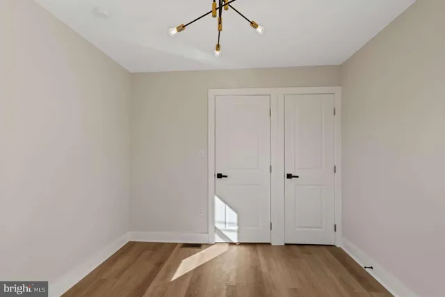 a view of an empty room with a fireplace