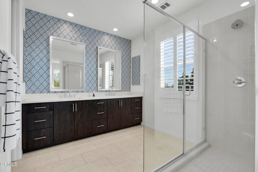 900 North Primrose Lane, Unit A Azusa, CA 91702 - Photo 23 of 55 a bathroom with a double vanity sink and mirror with shower